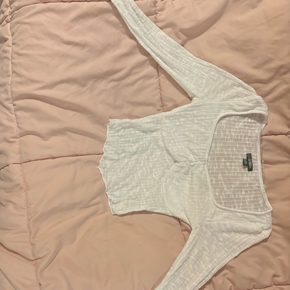 White long sleeve shirt, the sleeves and bottom half are a bit see through
